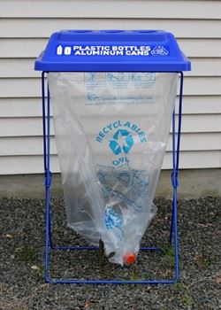 A blue container labeled, "Plastic bottles and aluminum cans."