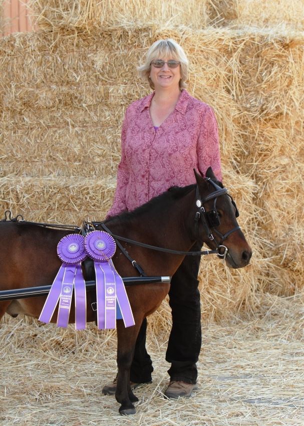 A woman poses next to her award winning pony at the 2014 Klickitat County Fair.