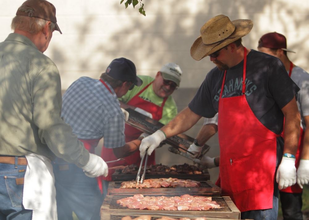 Members of the community cook food at the 2014 Klickitat County Fair.