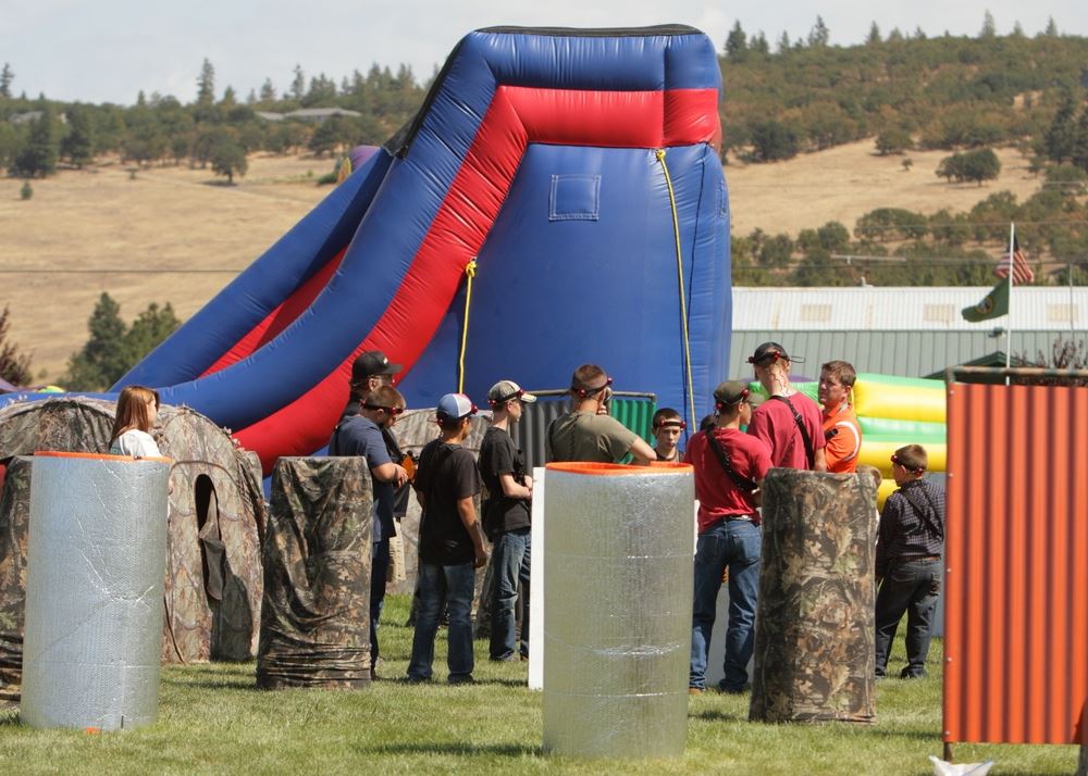 A group stands around at the laser tag area.