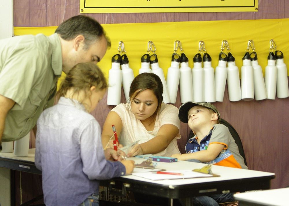 A little girl prepares to decorate her reusable water bottle at the 2014 Klickitat County Fair.