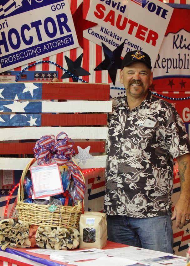 A man stands at a patriotic exhibit at the 2014 Klickitat County Fair.