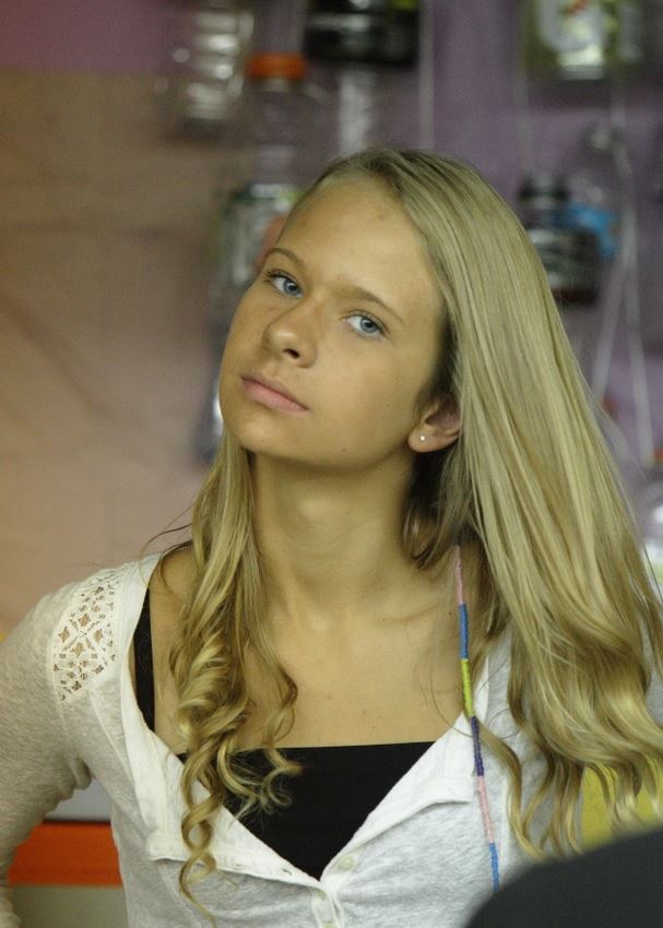 A girl shows her fancy hair wrap at the 2014 Klickitat County Fair.