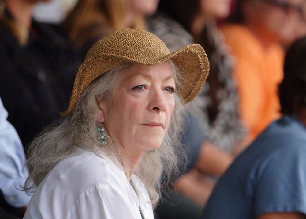 A woman sits among the crowd at the 2014 Klickitat County Fair.
