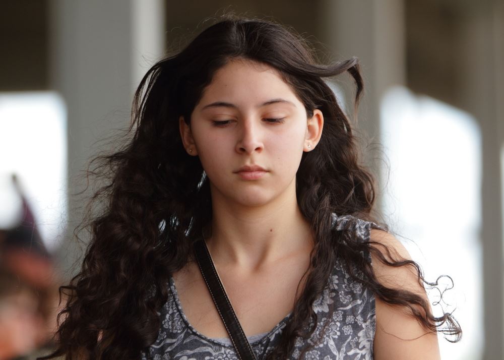 A girl walks through the crowd at the 2014 Klickitat County Fair.