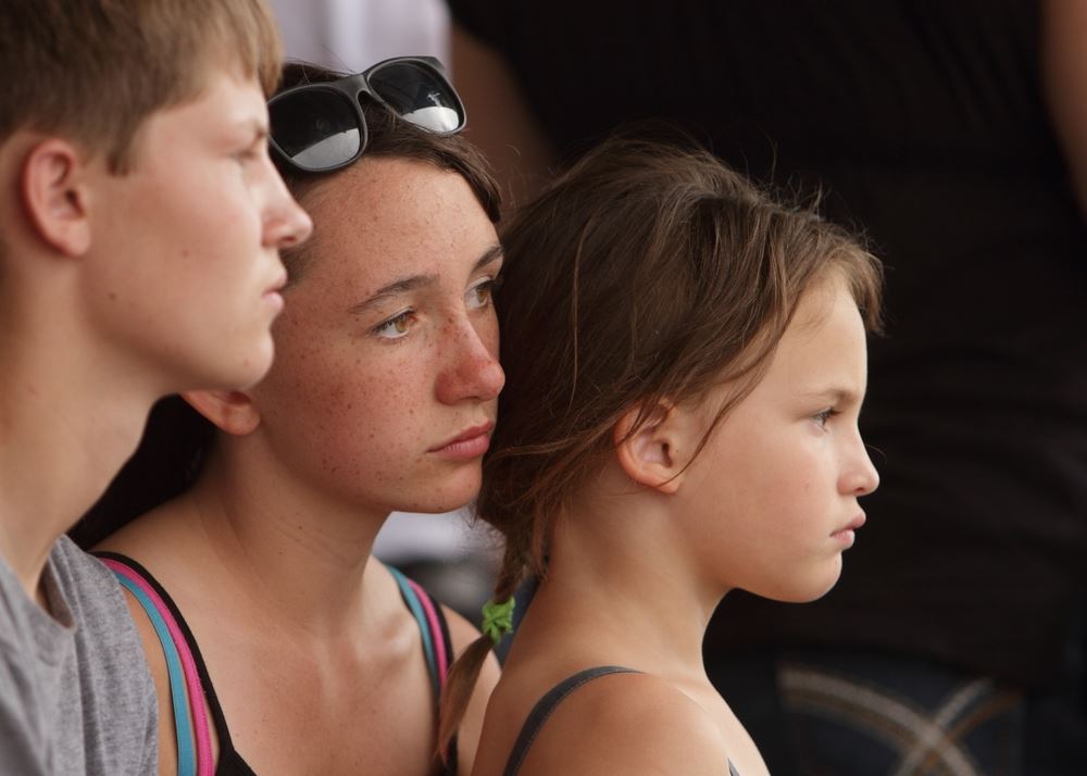 A woman and little girl sit among the crowd at the 2014 Klickitat County Fair.