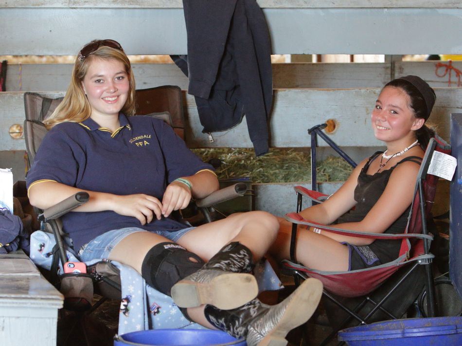 Two girls take a break duirng the 2015 Klickitat County Fair.