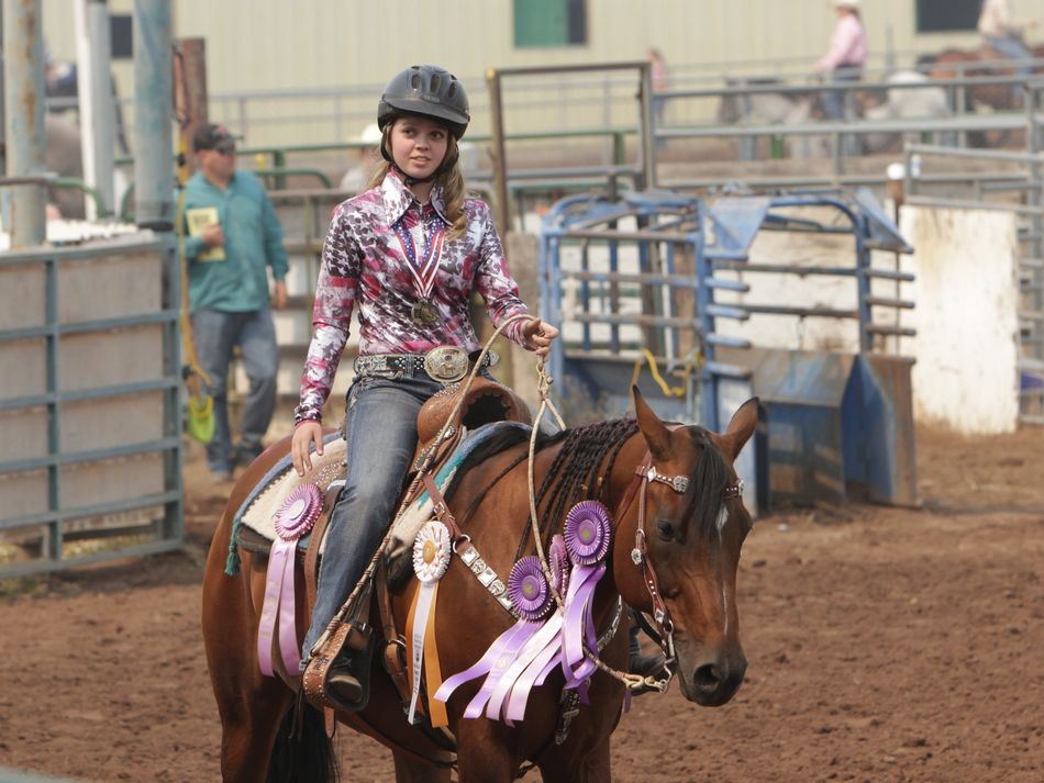 Girl rides her horse for the crowd at the 2015 Klickitat County Fair.