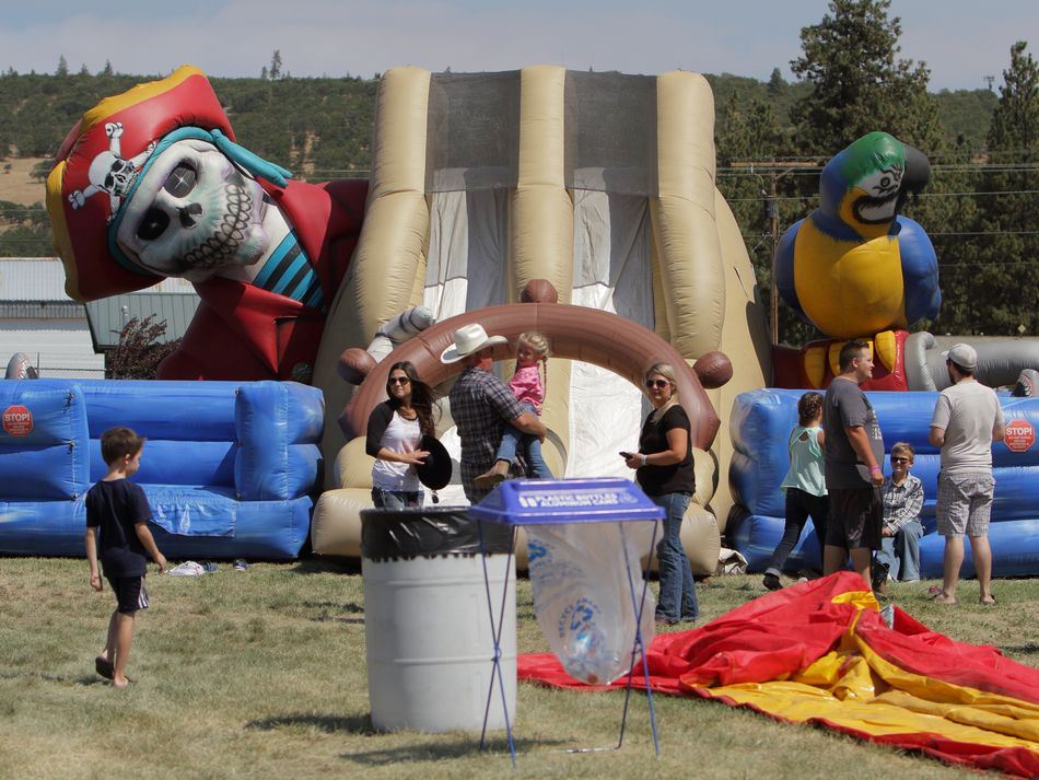 People stand in line for the giant blow-up slide.